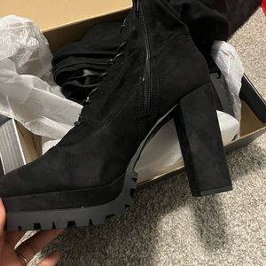 Knee high heeled boots